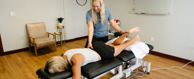 physical therapist assessing for source of back pain