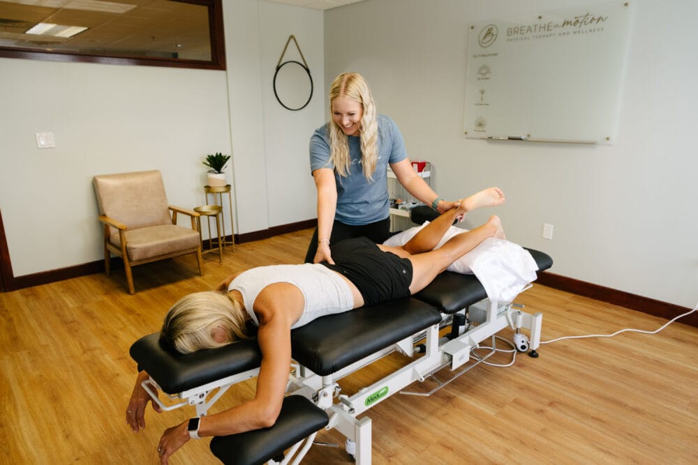 physical therapist assessing for source of back pain