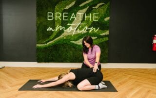 physical therapist incorporating prenatal yoga into a session