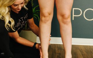 Physical therapist doing corrective exercise after an ankle sprain