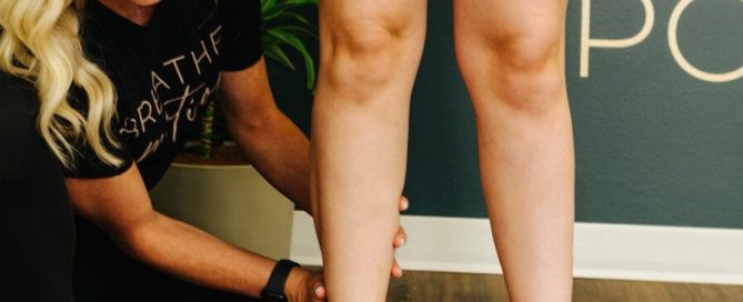 Physical therapist doing corrective exercise after an ankle sprain