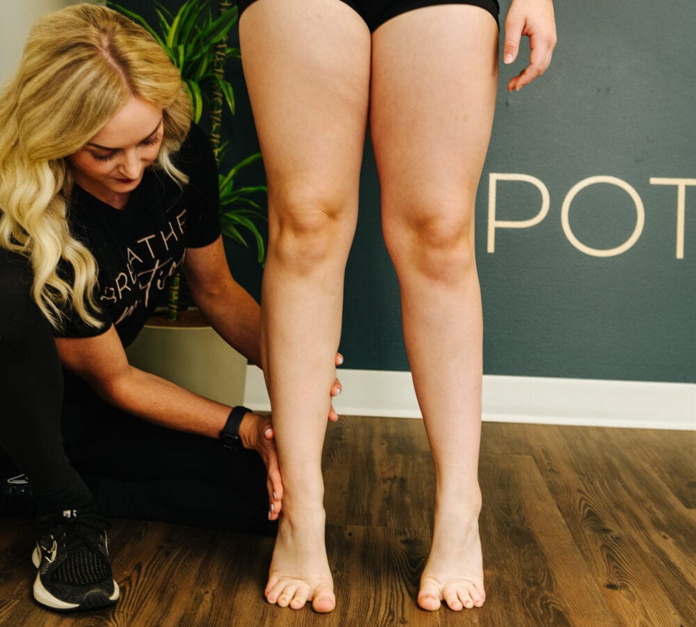 Physical therapist doing corrective exercise after an ankle sprain