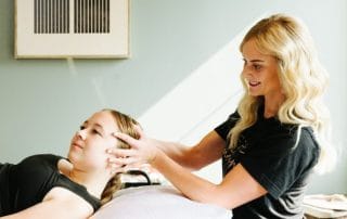 physical therapist assessing for neck range of motion