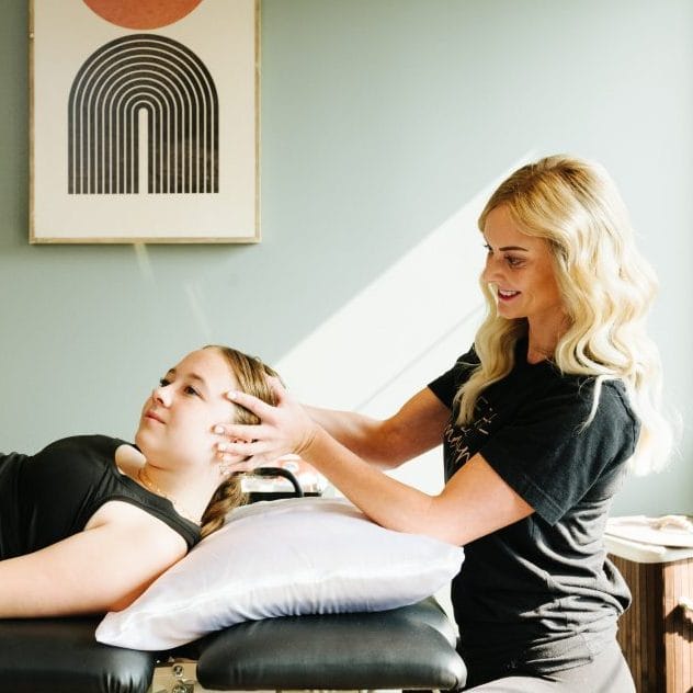 physical therapist assessing for neck range of motion