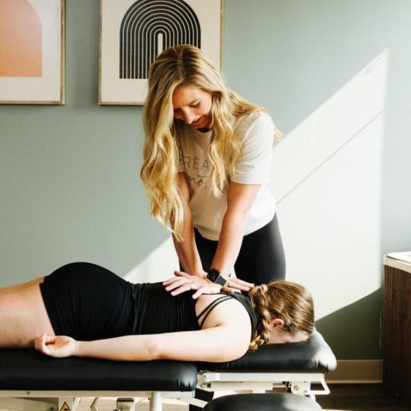 physical therapist performing thoracic mobilizations
