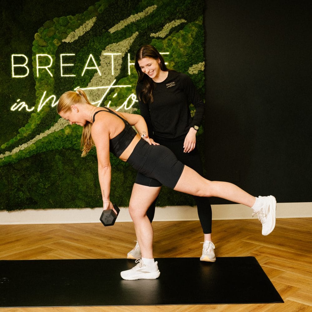 physical therapist reviewing single leg RDL form