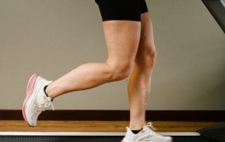 female running on treadmill