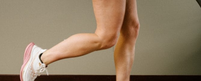 female running on treadmill