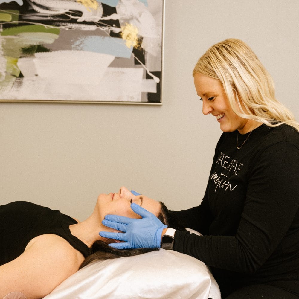 physical therapist assessing for TMJ dysfunction